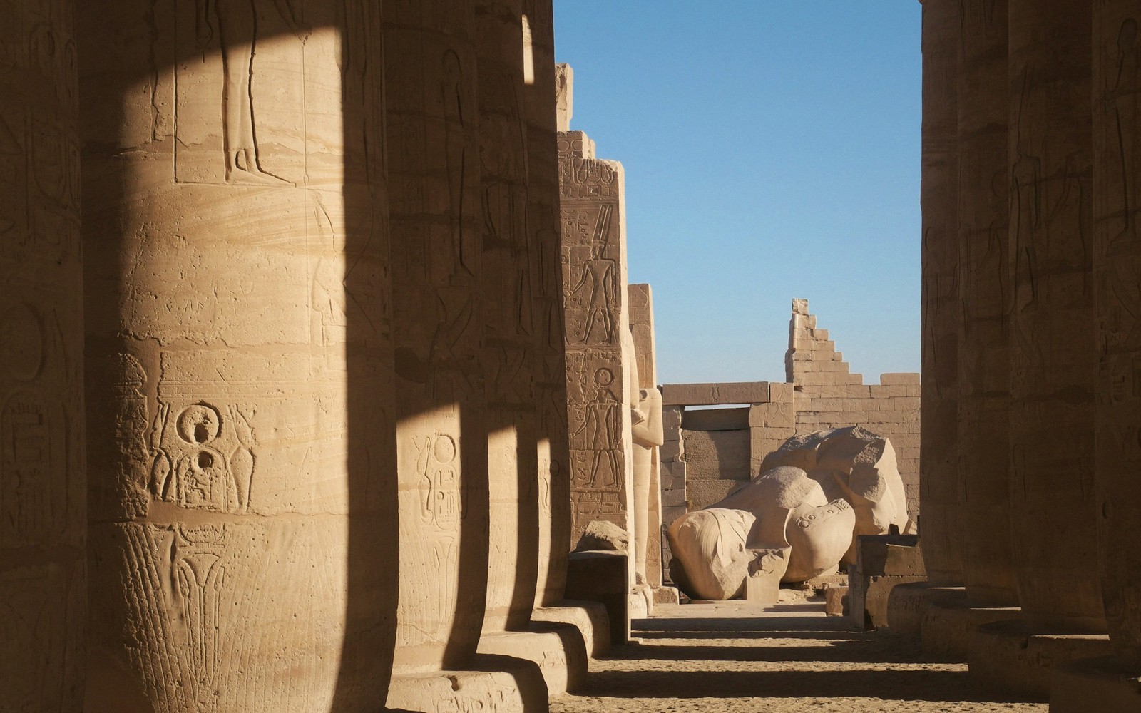 Temple colonnade lit by low sun