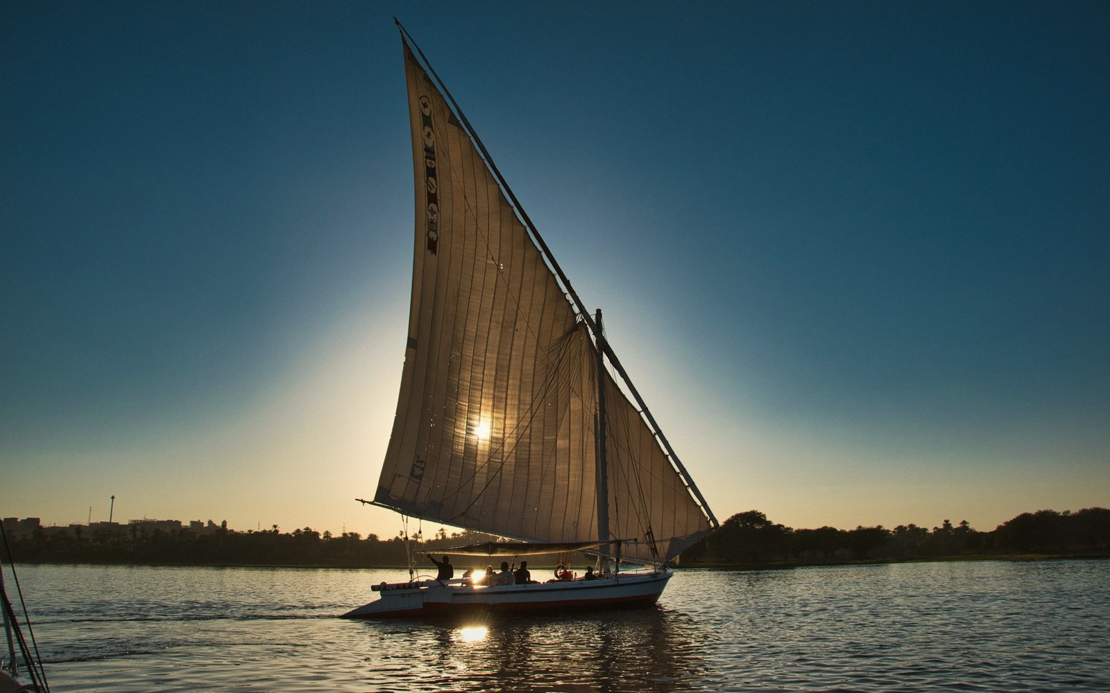A felucca sail on the Nile at dusk